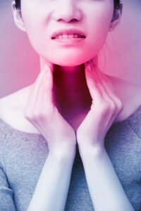 women with thyroid gland problem on the blue background