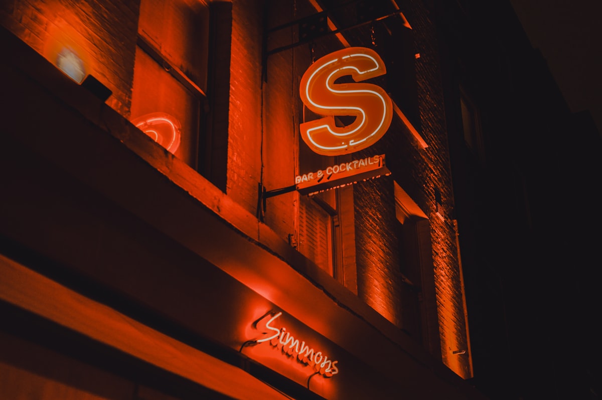 a neon sign on the side of a building
